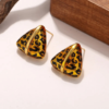 Aretes Triangulares Animal Print Dorado