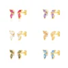SET DE AROS DORADOS MARIPOSAS Y HOJAS CON BRILLOS