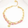 PULSERA DORADA DOBLE CON DETALLES ROSADOS